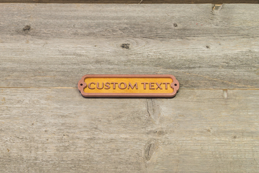 Your own Text, Custom Door Sign. 12 inch wide. Covered with powdered brass.